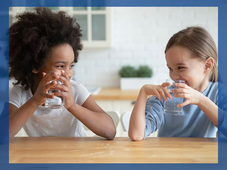 kids drinking water at the table